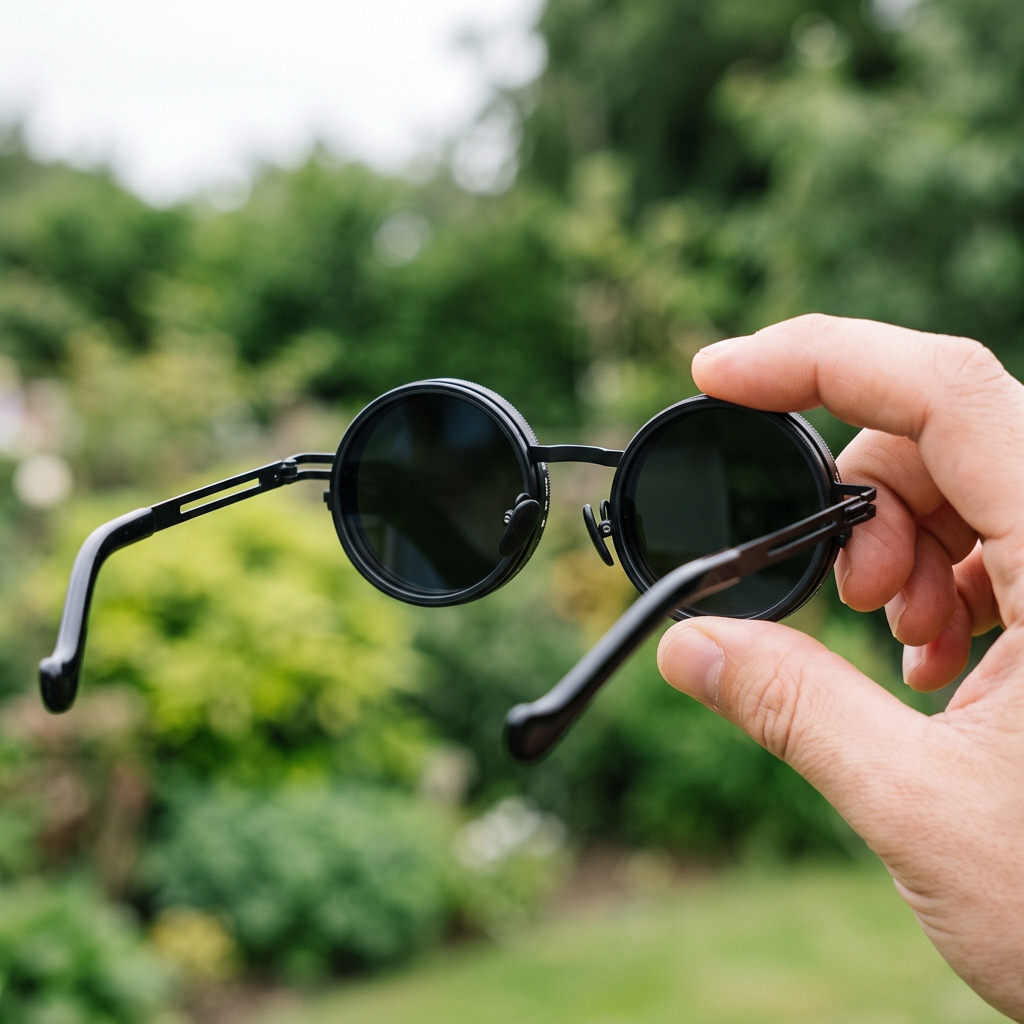 Black Shadewell sunglasses showing the lens rim and slim metal arm
