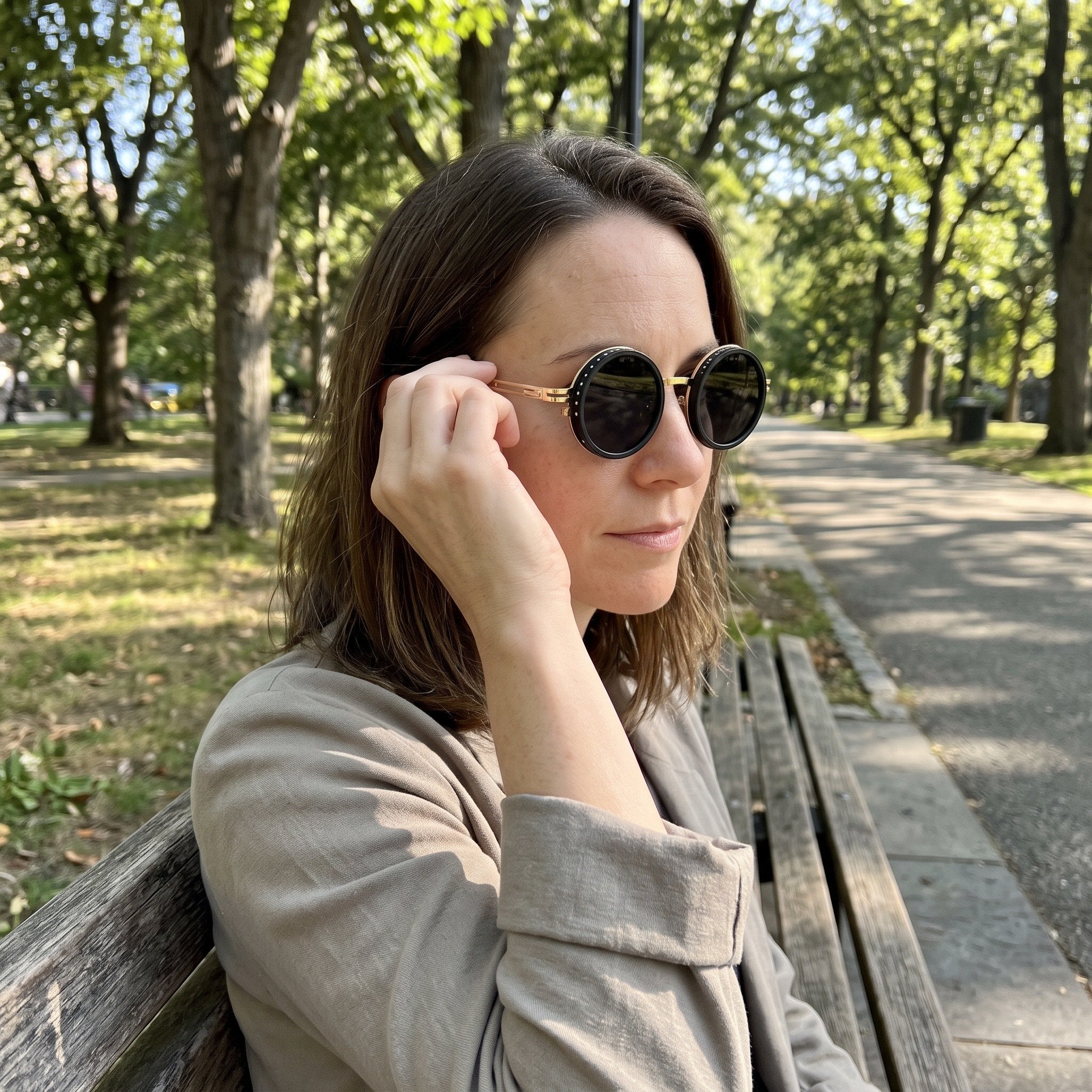 Gold Shadewell sunglasses in a sunlit park