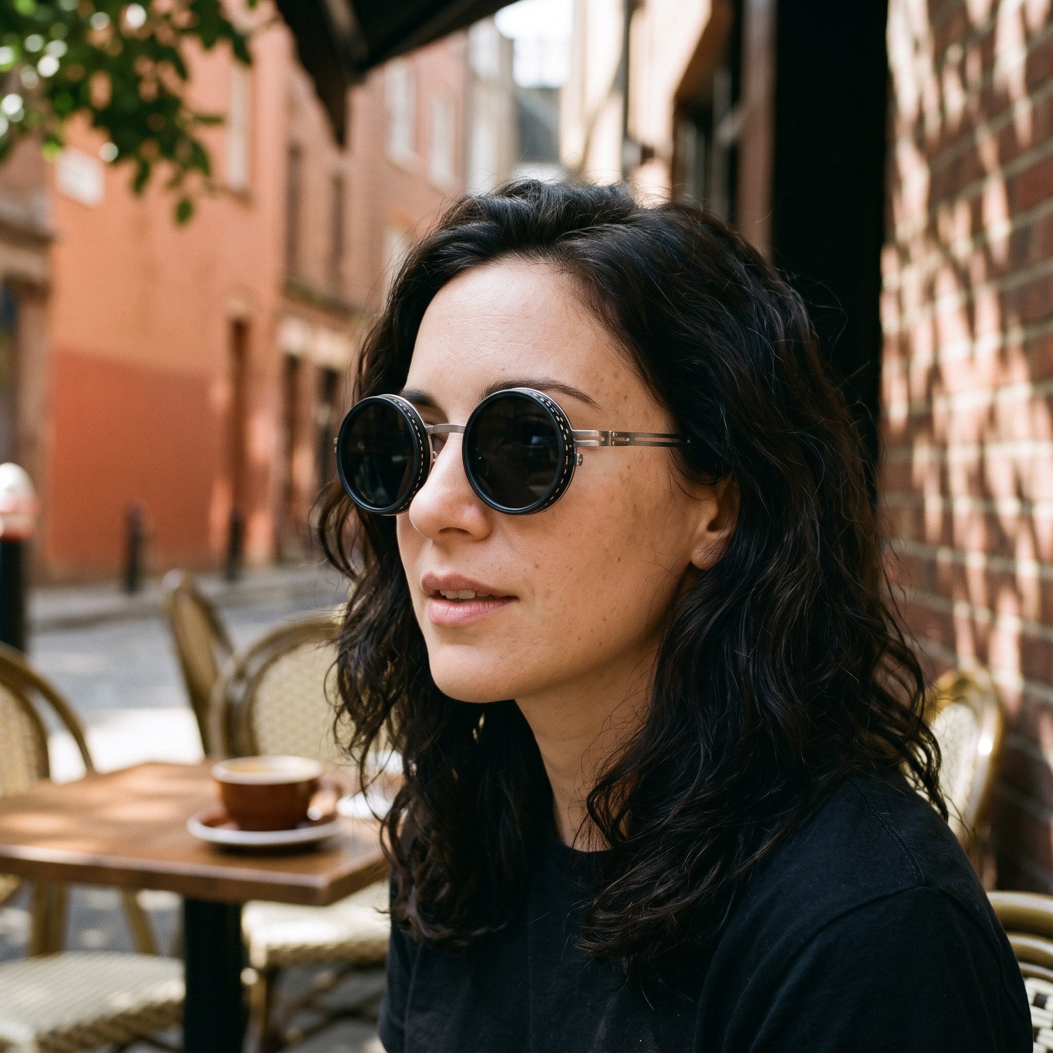 Silver Shadewell sunglasses worn at an outdoor cafe