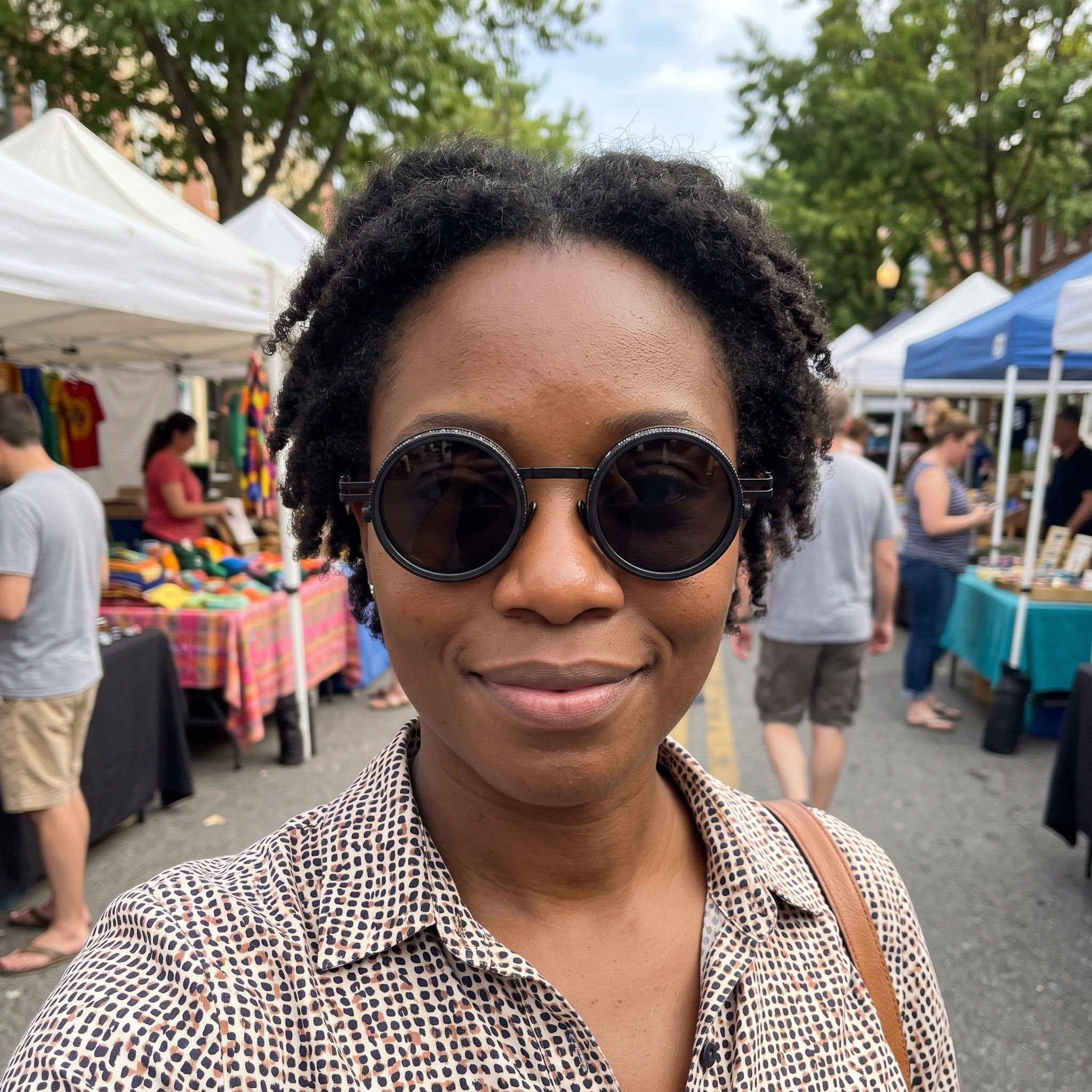 Black sunglasses worn at a weekend market